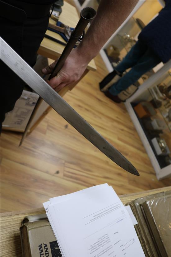 A Victorian sabre with etched blade and a mid 19th century sabre, both with scabbards